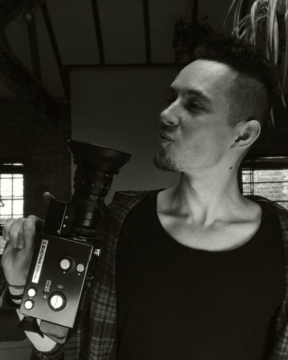 Andrei with a Leicina film camera, black and white